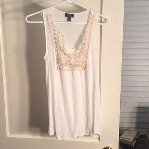 Sleeveless blouse with lace detailing.